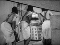 [A Dalek is confronted by Egyptian warriors.]