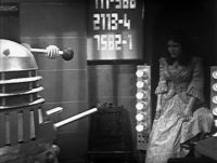 [Victoria Waterfield in the clutches of the Daleks.]