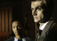 [Martha Jones and the Doctor as teacher John Smith.]