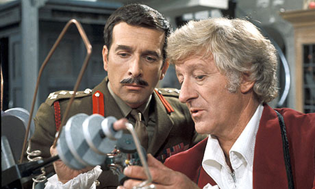 [The 3rd Doctor with frequent 1970s ally, Brigadier Alistair Gordon Lethbrige-Stewart, commander of the British contingent of UNIT.]